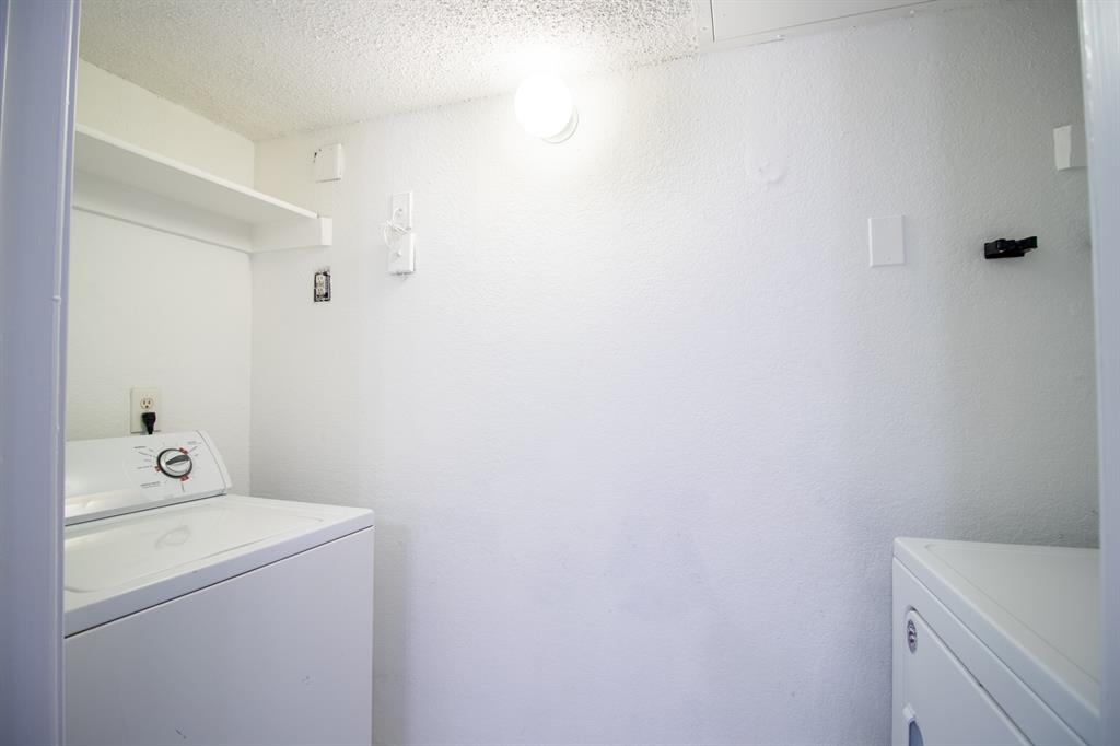 4777 Cedar Springs Road, Unit 4D Dallas, TX 75219 - Photo 16 of 20 a utility room with dryer and washer