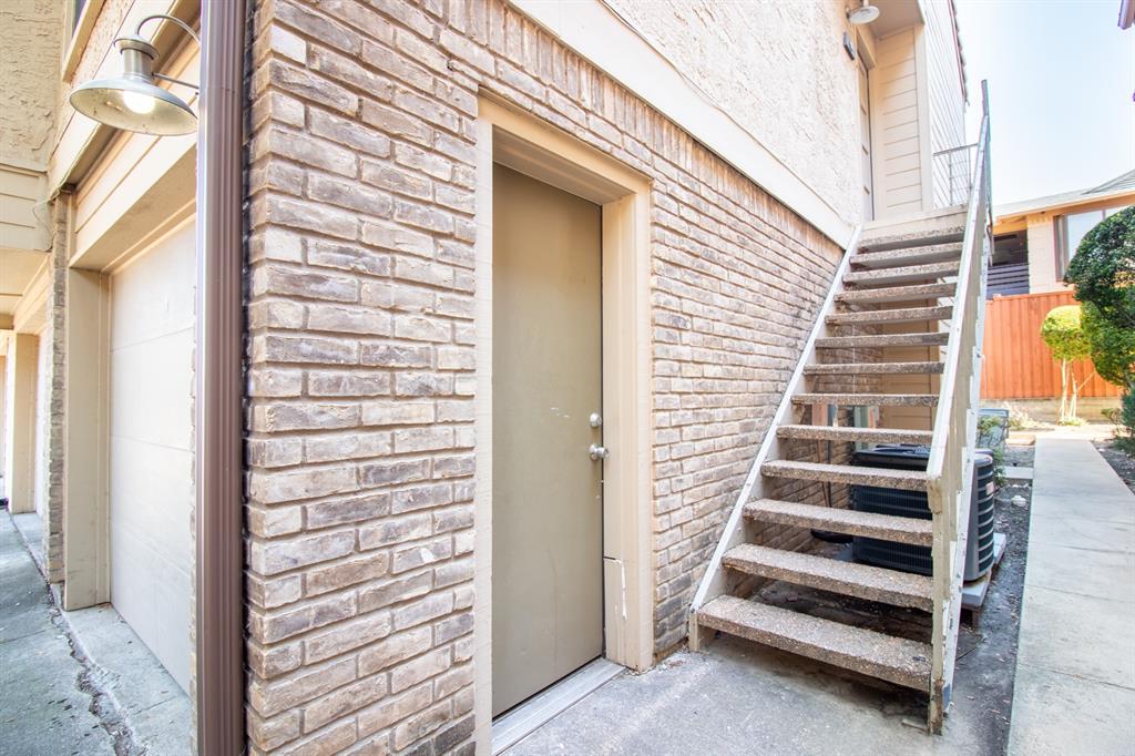 4777 Cedar Springs Road, Unit 4D Dallas, TX 75219 - Photo 20 of 20 a view of a balcony with stairs and white walls