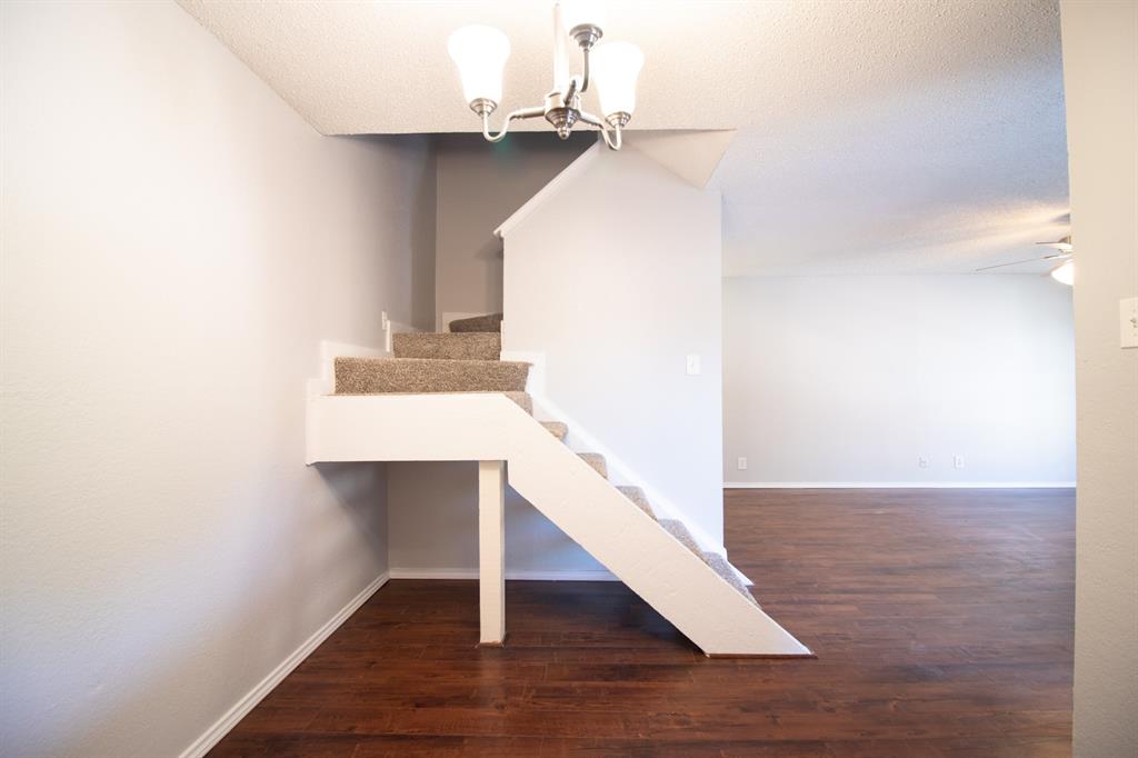 4777 Cedar Springs Road, Unit 4D Dallas, TX 75219 - Photo 8 of 20 a view of entryway and hall with wooden floor