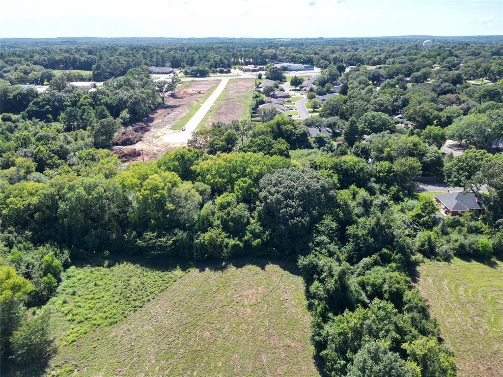 Lot 15 Central Park Athens, TX 75751 - Photo 25 of 37 an aerial view of a house with a yard and lake view