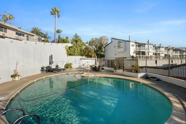 a view of a swimming pool with a patio