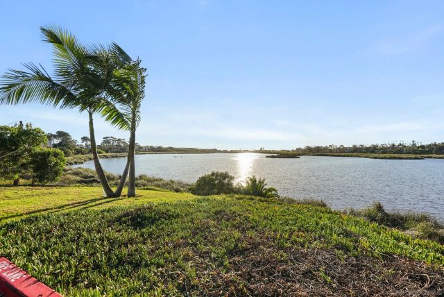 a view of a lake from a yard