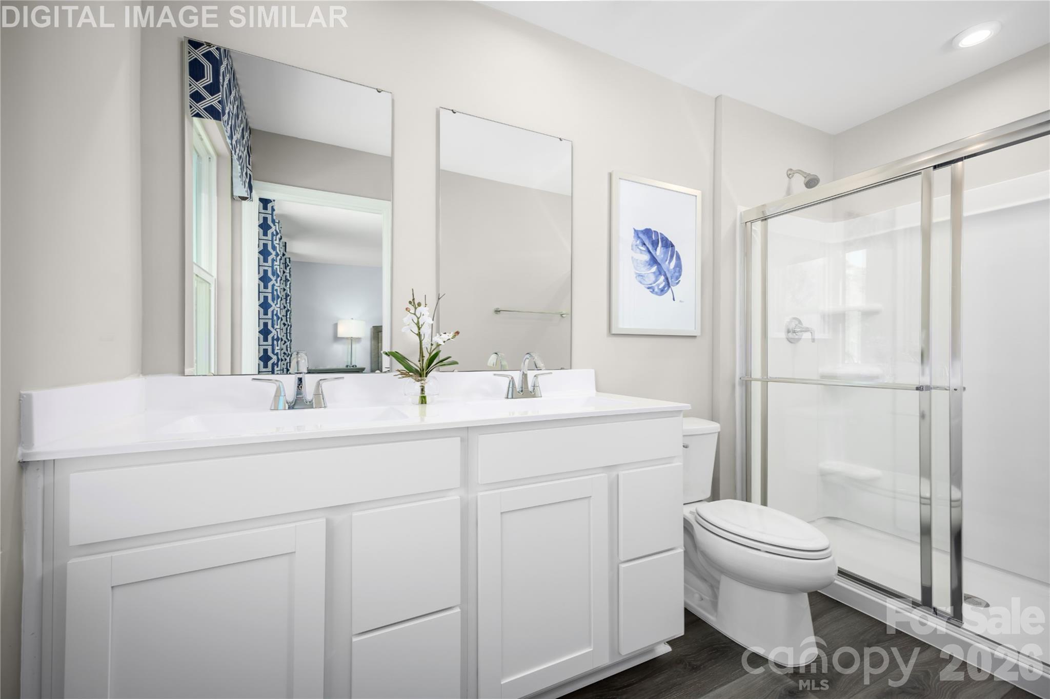 11017 Rococo Lane Charlotte, NC 28214 - Photo 11 of 24 a bathroom with a toilet sink a shower and a mirror