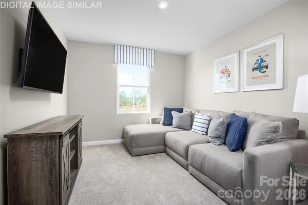 a living room with a couch and a flat screen tv