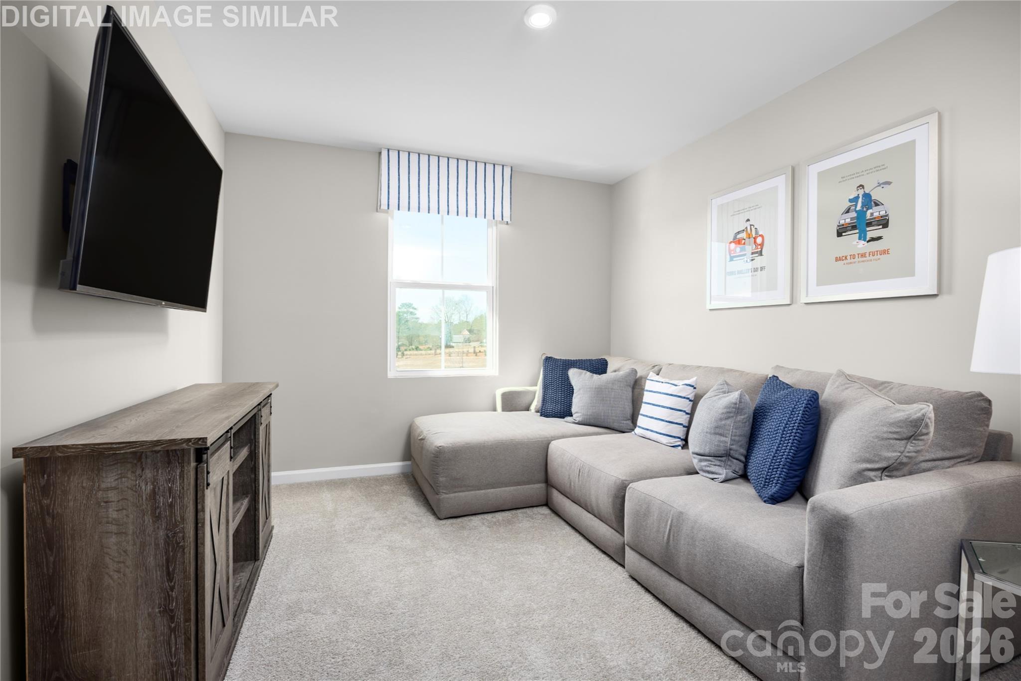 11017 Rococo Lane Charlotte, NC 28214 - Photo 16 of 24 a living room with a couch and a flat screen tv