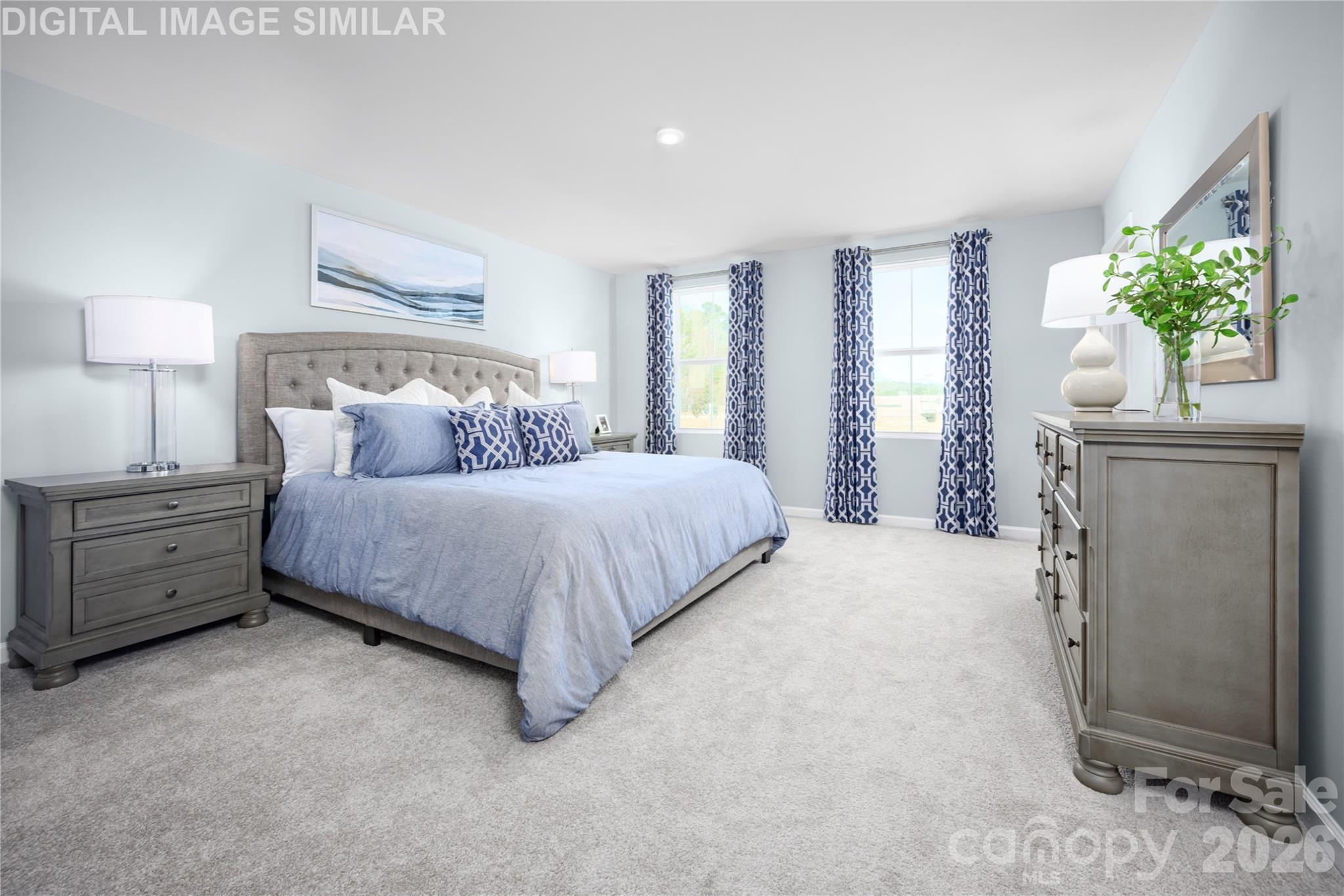 11017 Rococo Lane Charlotte, NC 28214 - Photo 10 of 24 a bedroom with a bed and a couch