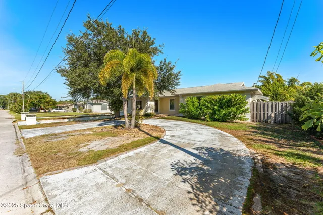 a view of a patio with table and chairs with wooden floor and fence