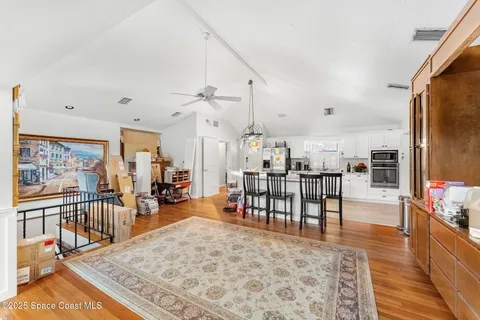 a bathroom with a granite countertop sink a mirror and shower