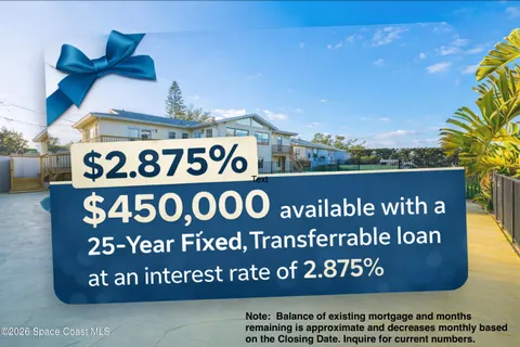 an aerial view of a house with a yard and swimming pool