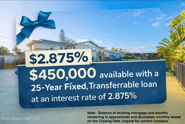 an aerial view of a house with a yard and swimming pool