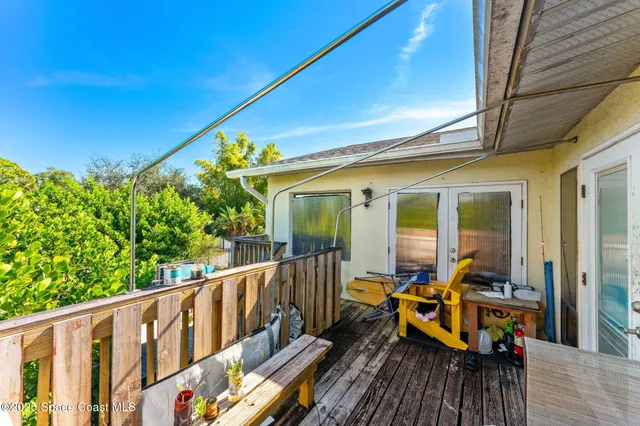 a view of a house with backyard outdoor seating area and barbeque oven