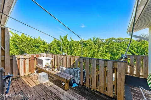 a view of a backyard with sitting area