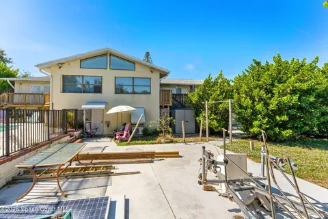 a view of balcony with wooden floor and outdoor seating