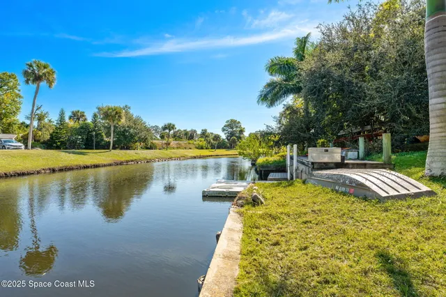 a view of a lake with a house in the background