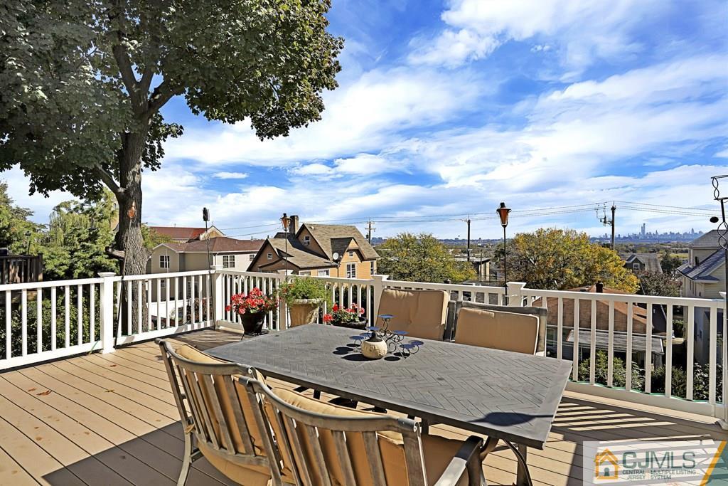 40 Prospect Terrace East Rutherford, NJ 07073 - Photo 14 of 16 a view of a roof deck with table and chairs