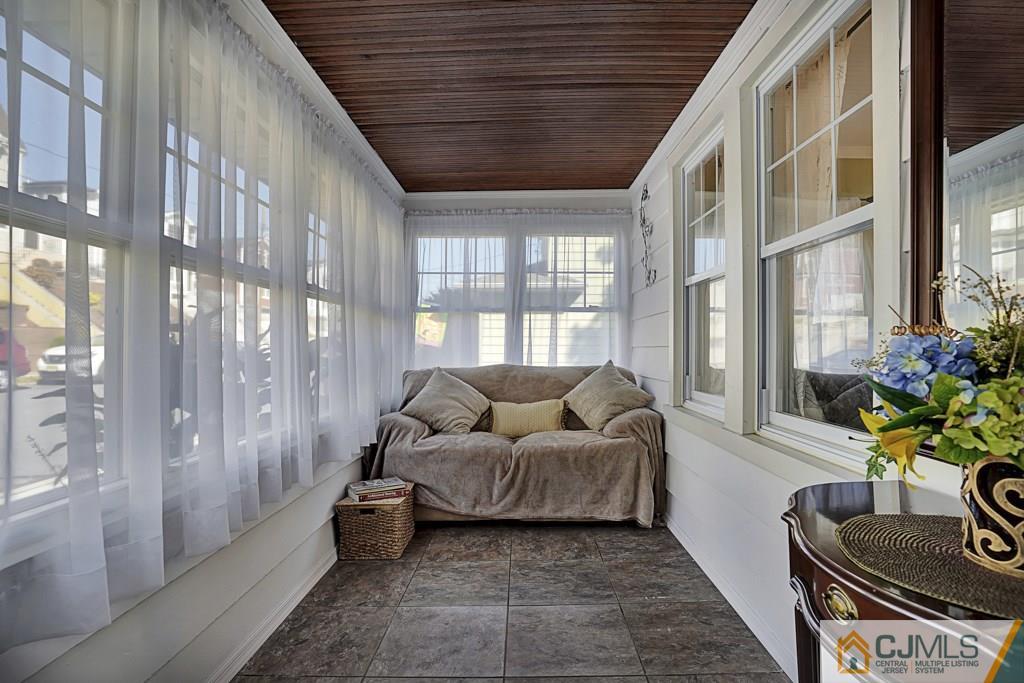 40 Prospect Terrace East Rutherford, NJ 07073 - Photo 3 of 16 a living room with furniture and a floor to ceiling window
