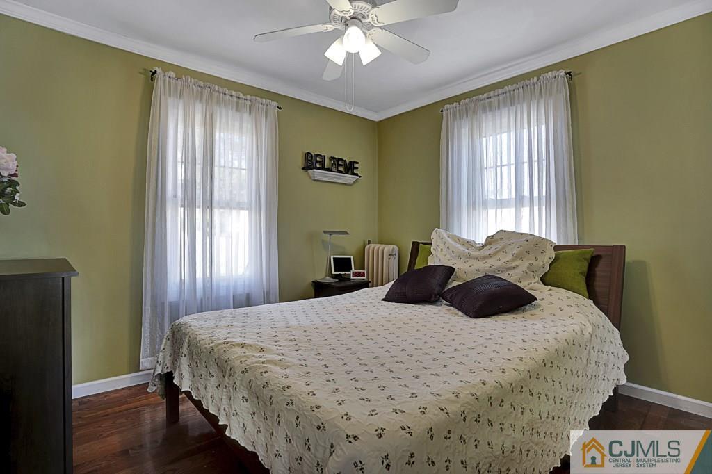 40 Prospect Terrace East Rutherford, NJ 07073 - Photo 8 of 16 a bedroom with a bed and window