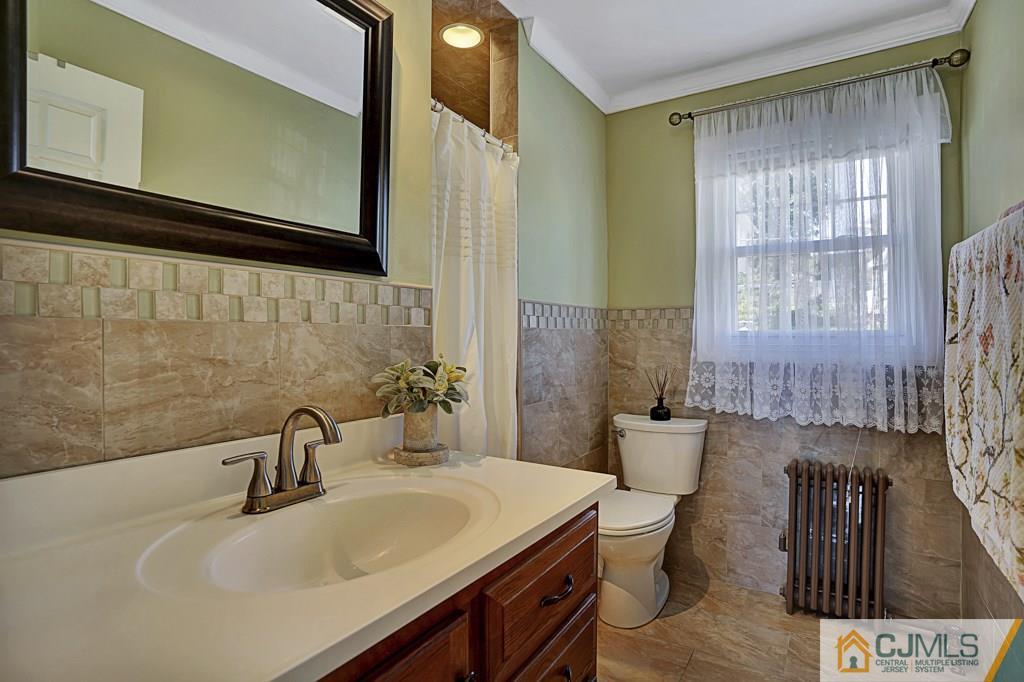 40 Prospect Terrace East Rutherford, NJ 07073 - Photo 9 of 16 a bathroom with a sink a toilet and shower