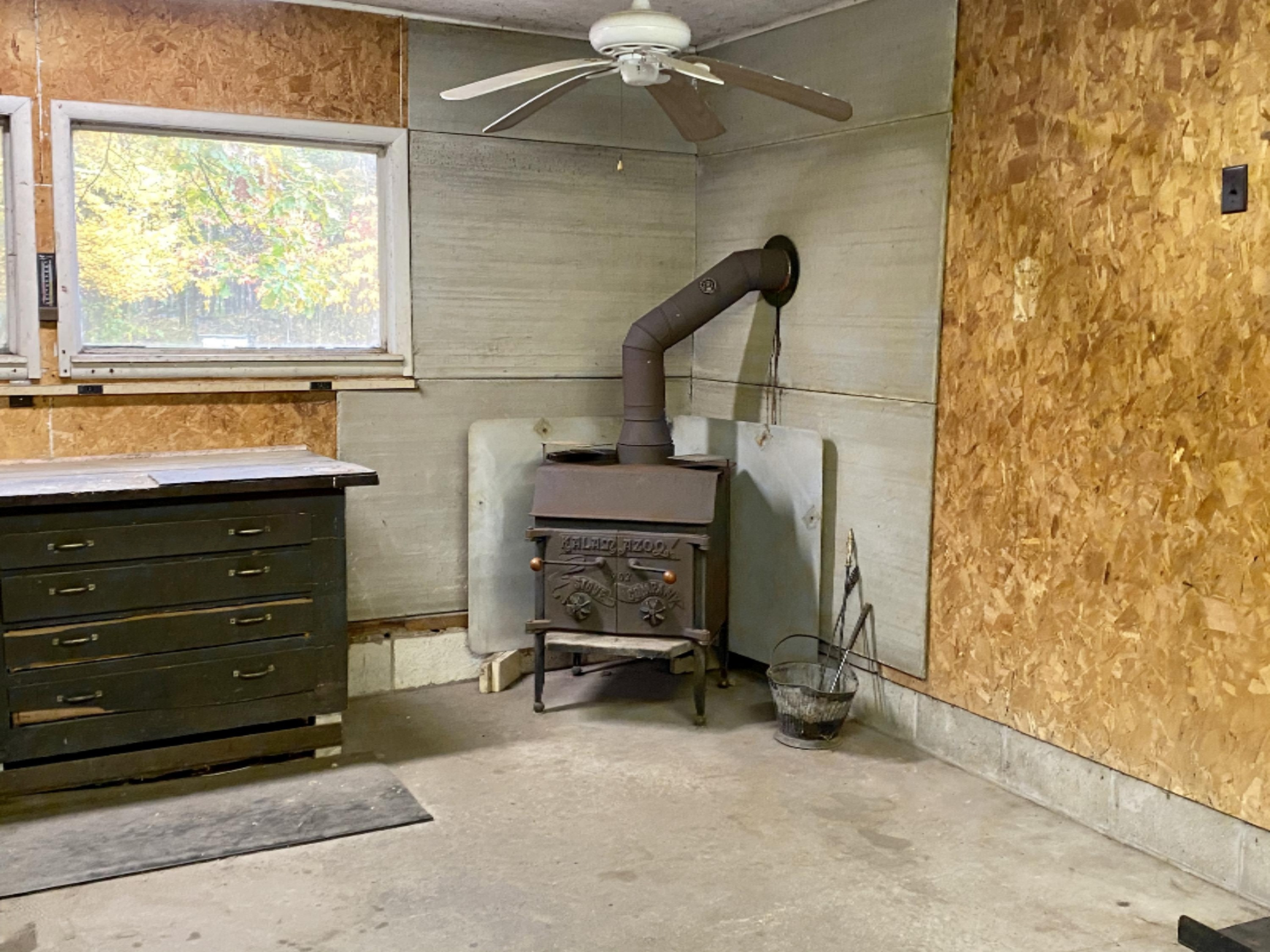 2088 Carty Road Manistee, MI 49660 - Photo 28 of 42 Wood stove for heat in garage