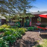 a view of a backyard with sitting area and furniture
