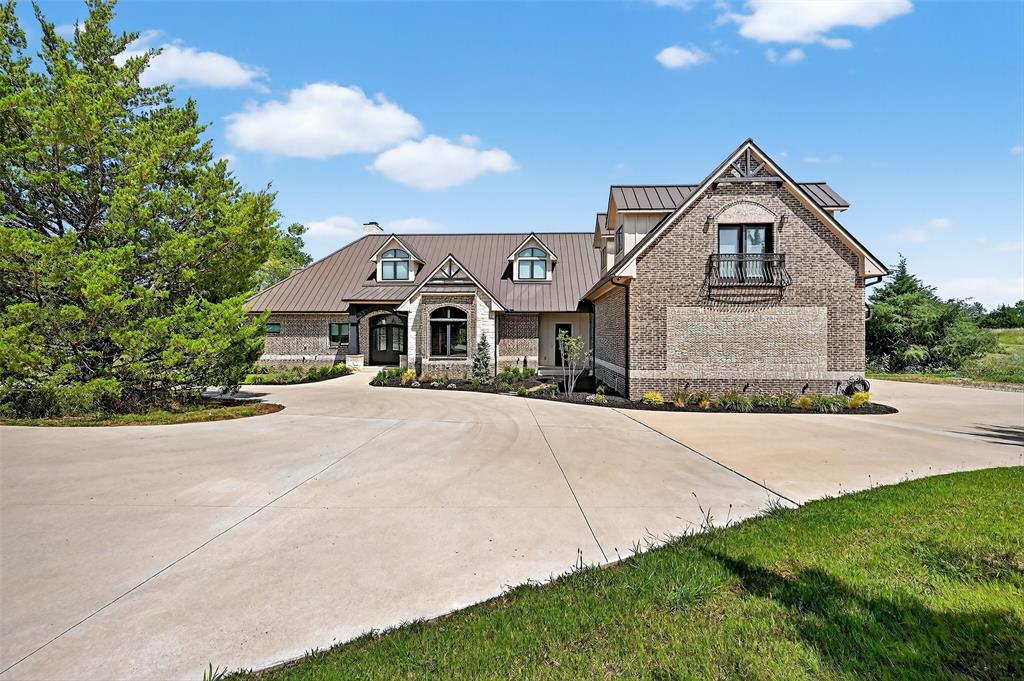 1770 Durning Road Van Alstyne, TX 75495 - Photo 16 of 40 a front view of a house with a yard and garage