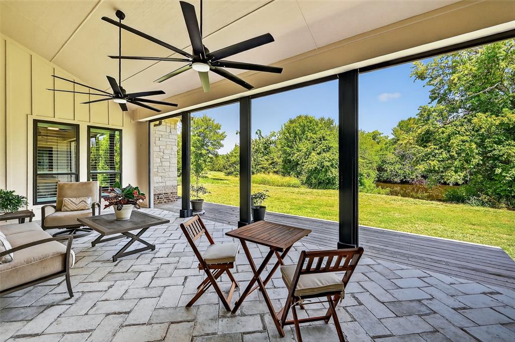 1770 Durning Road Van Alstyne, TX 75495 - Photo 2 of 40 a view of a patio with a table chairs and a floor to ceiling window