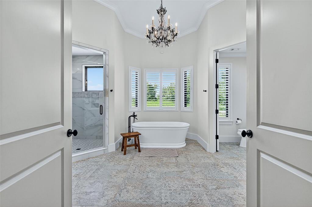 1770 Durning Road Van Alstyne, TX 75495 - Photo 37 of 40 a spacious bathroom with a tub shower and window