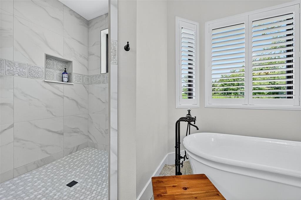 1770 Durning Road Van Alstyne, TX 75495 - Photo 40 of 40 a bathroom with a tub and a shower