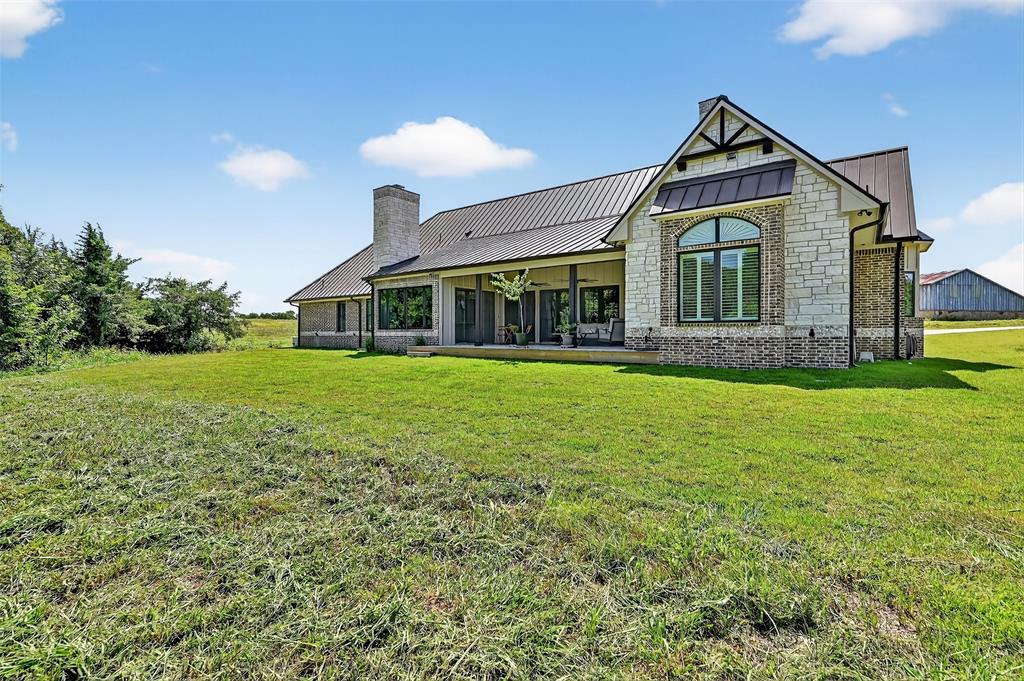 1770 Durning Road Van Alstyne, TX 75495 - Photo 10 of 40 a front view of a house with a yard and potted plants