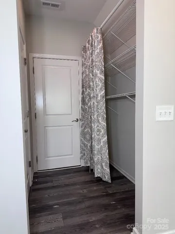 a view of entryway with wooden floor