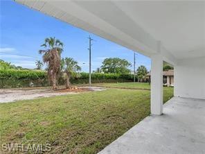 4330 Gulfstream Drive Naples, FL 34112 - Photo 13 of 15 a view of a garden with a building