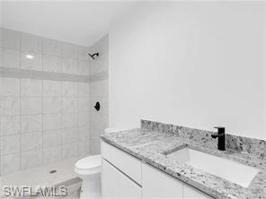 4330 Gulfstream Drive Naples, FL 34112 - Photo 8 of 15 a bathroom with a granite countertop sink and a mirror