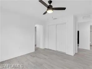 a view of empty room with ceiling fan