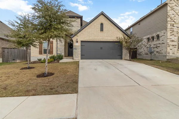 a front view of a house with yard
