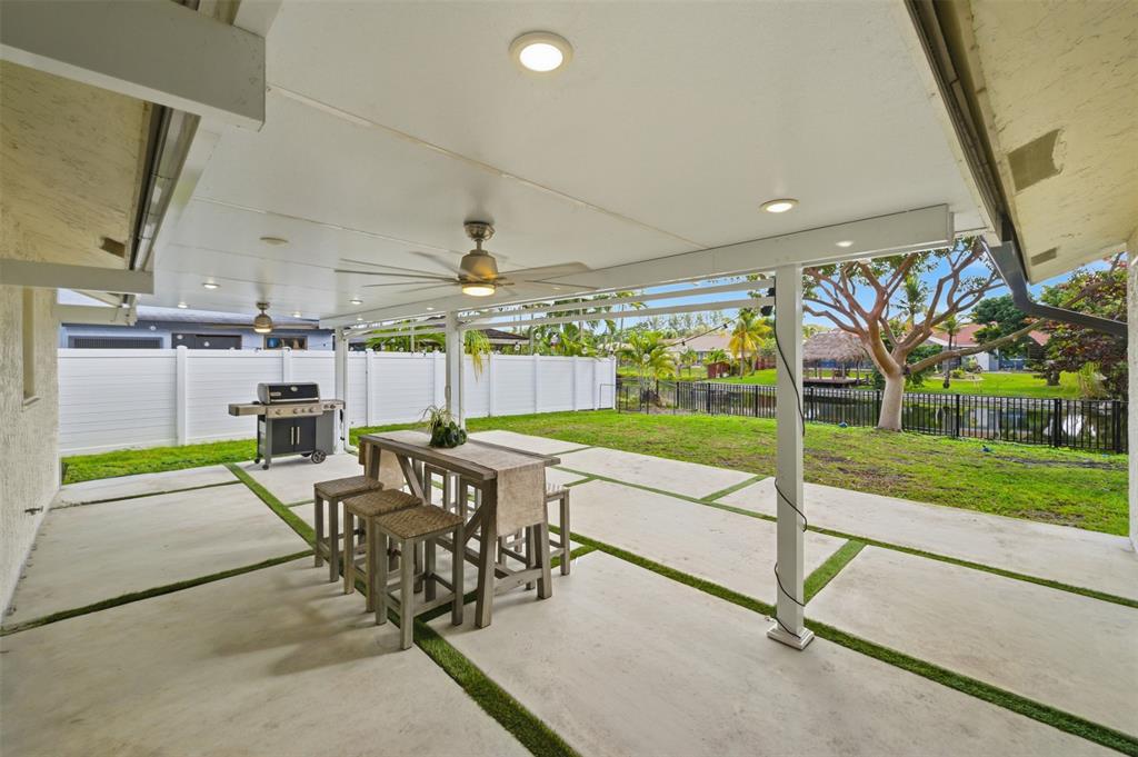 8340 Southwest 27th Place Davie, FL 33328 - Photo 1 of 25 a view of a patio with table and chairs