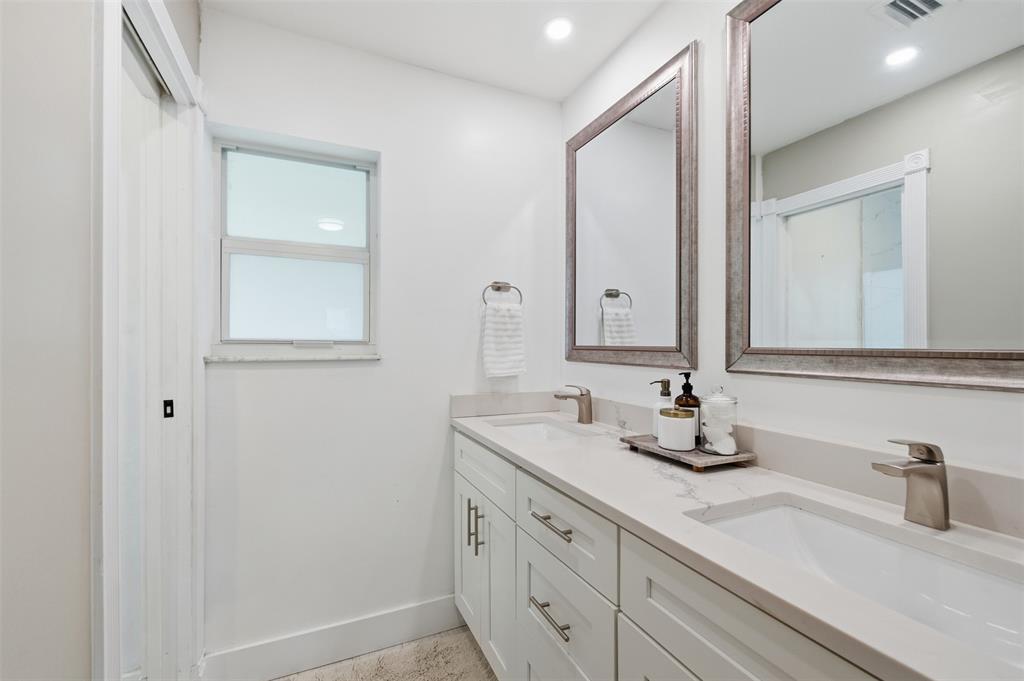 8340 Southwest 27th Place Davie, FL 33328 - Photo 13 of 25 a bathroom with a double vanity sink and a mirror
