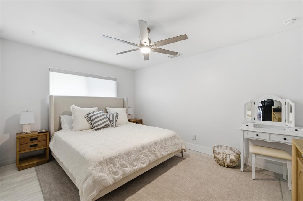 8340 Southwest 27th Place Davie, FL 33328 - Photo 16 of 25 a bedroom with a bed and a chandelier