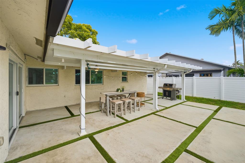 8340 Southwest 27th Place Davie, FL 33328 - Photo 19 of 25 front view of a house with a patio