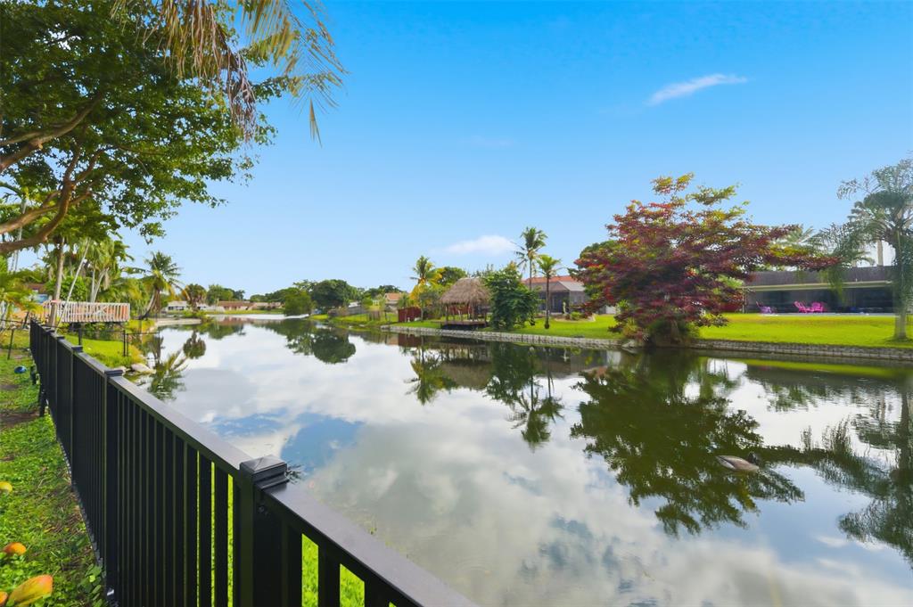 8340 Southwest 27th Place Davie, FL 33328 - Photo 21 of 25 a view of a lake from a balcony