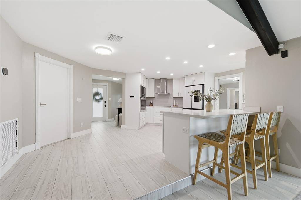 8340 Southwest 27th Place Davie, FL 33328 - Photo 6 of 25 a living room with furniture and kitchen view