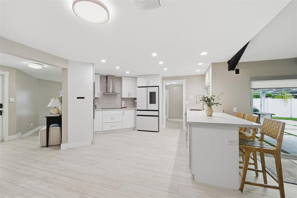 8340 Southwest 27th Place Davie, FL 33328 - Photo 7 of 25 a view of kitchen with furniture and refrigerator