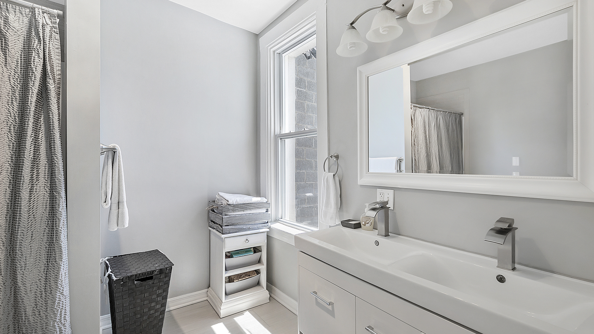 2339 West Maypole Avenue Chicago, IL 60612 - Photo 13 of 20 a bathroom with a sink and a mirror