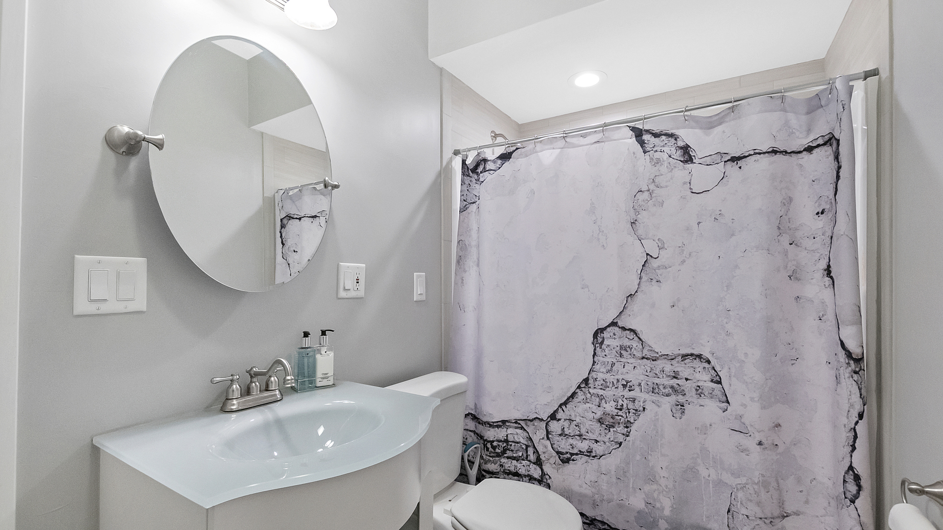 2339 West Maypole Avenue Chicago, IL 60612 - Photo 15 of 20 a bathroom with a sink toilet and shower