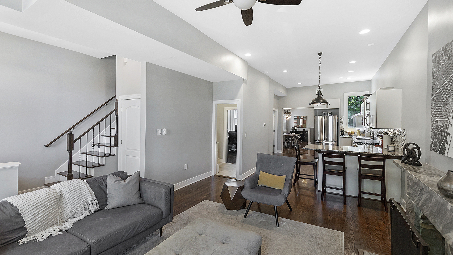 2339 West Maypole Avenue Chicago, IL 60612 - Photo 3 of 20 a living room with furniture kitchen view and a wooden floor