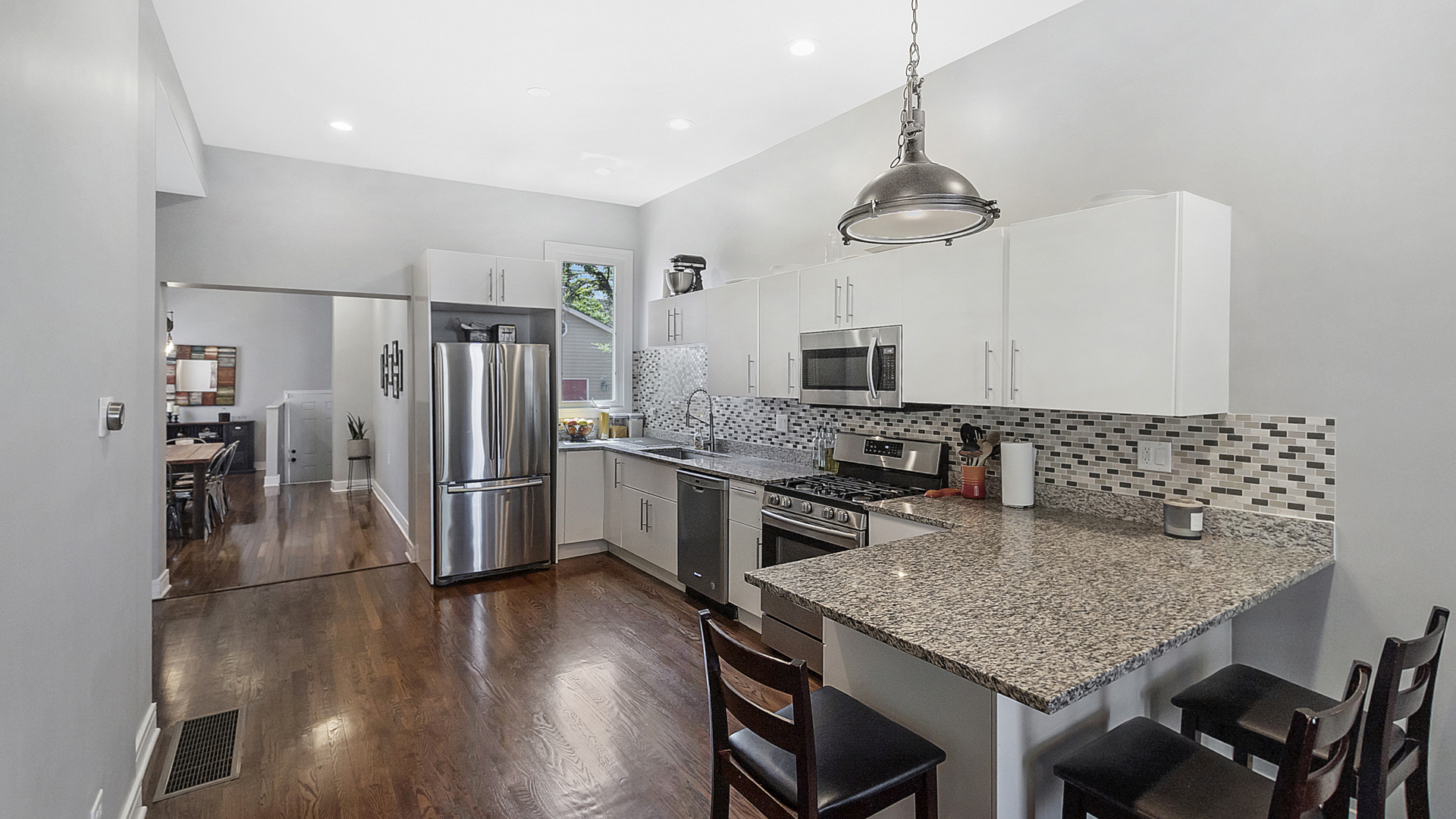2339 West Maypole Avenue Chicago, IL 60612 - Photo 5 of 20 a kitchen with a center island and stainless steel appliances