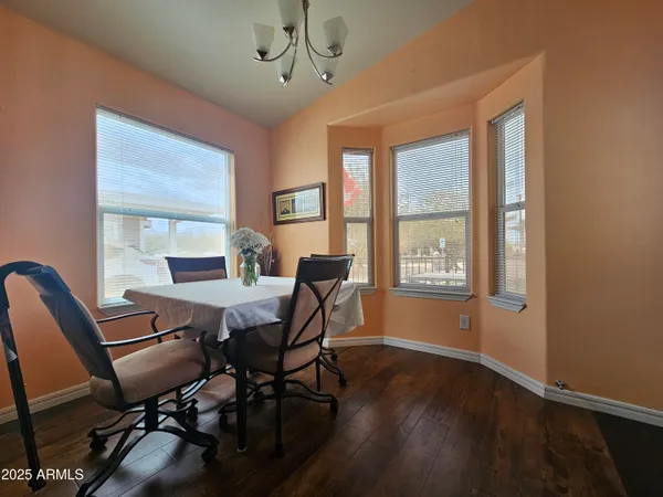 a living room with fireplace furniture and a large window