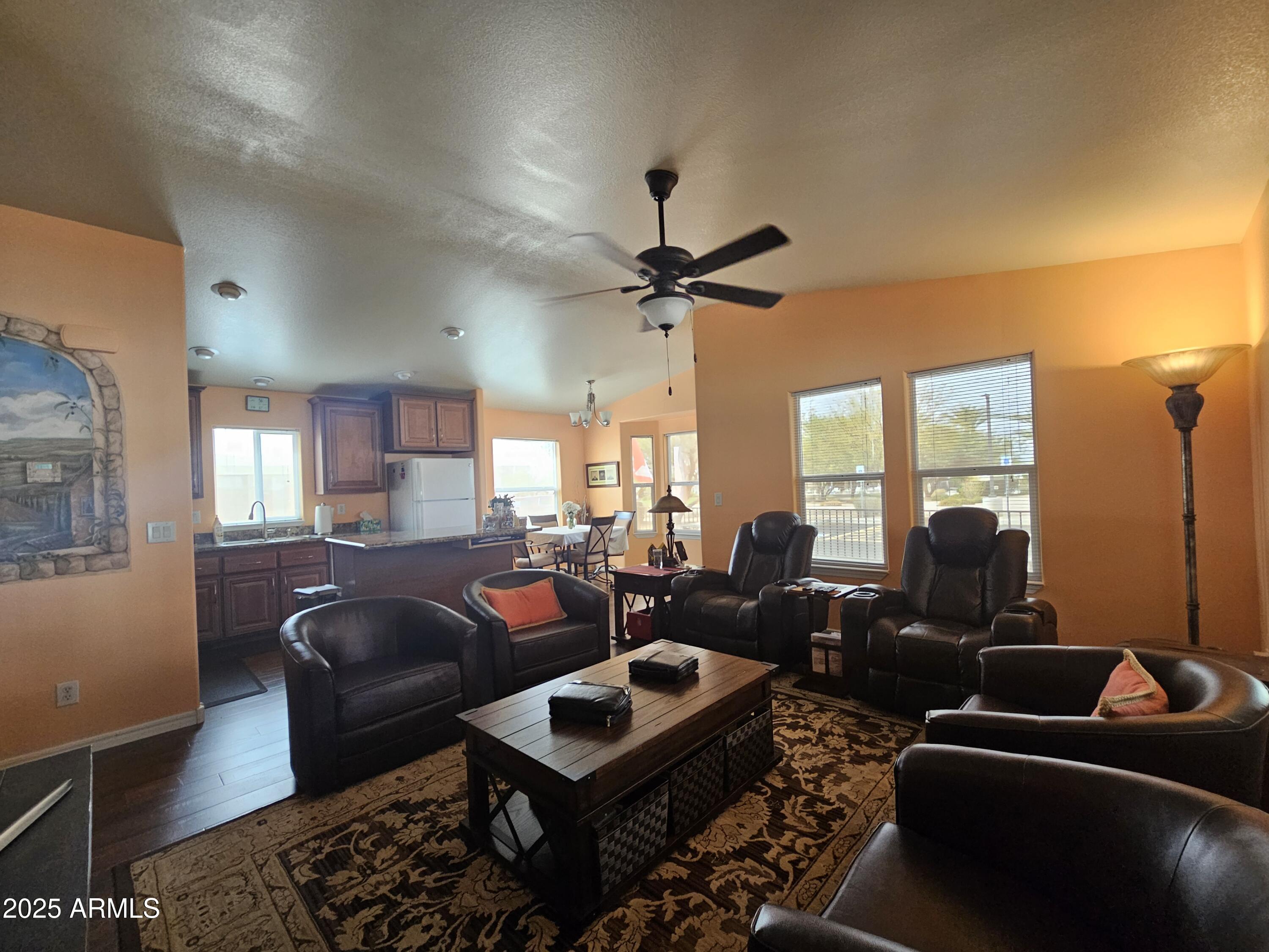 650 North Hawes Road, Unit 4326 Mesa, AZ 85207 - Photo 21 of 48 a living room with furniture a ceiling fan and a rug