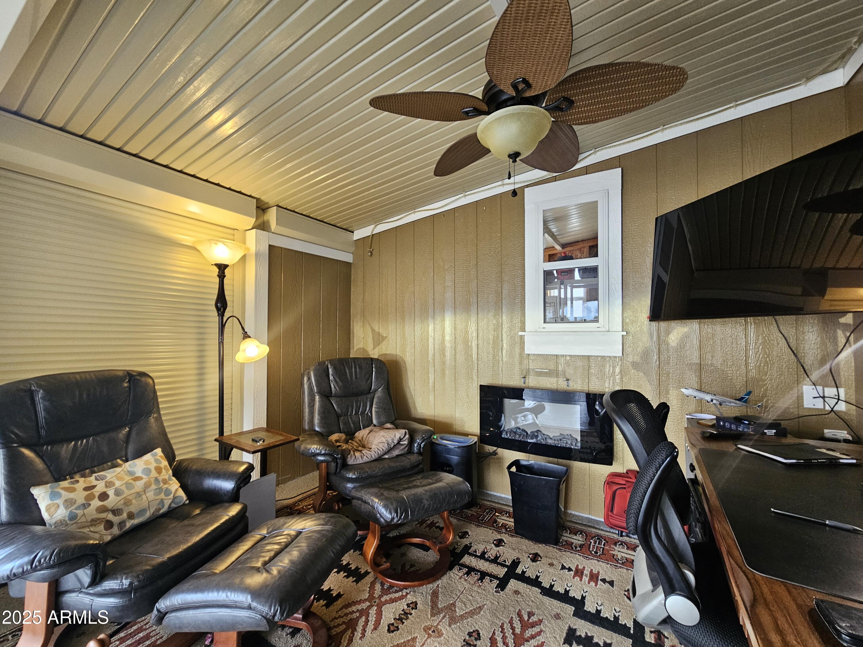650 North Hawes Road, Unit 4326 Mesa, AZ 85207 - Photo 31 of 48 a living room with furniture and a flat screen tv