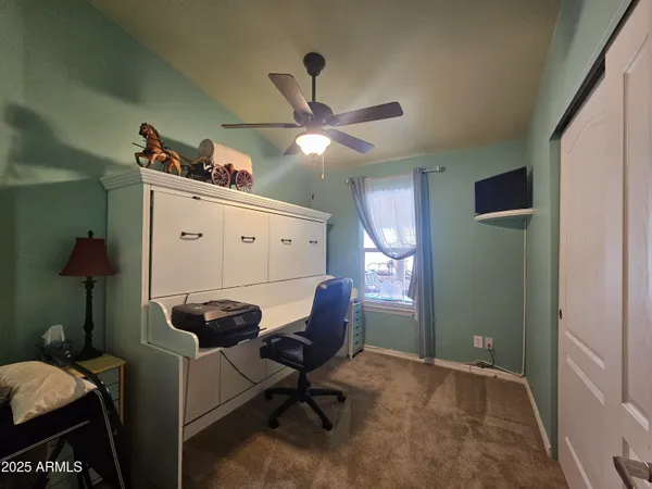 a workspace with furniture and chandelier