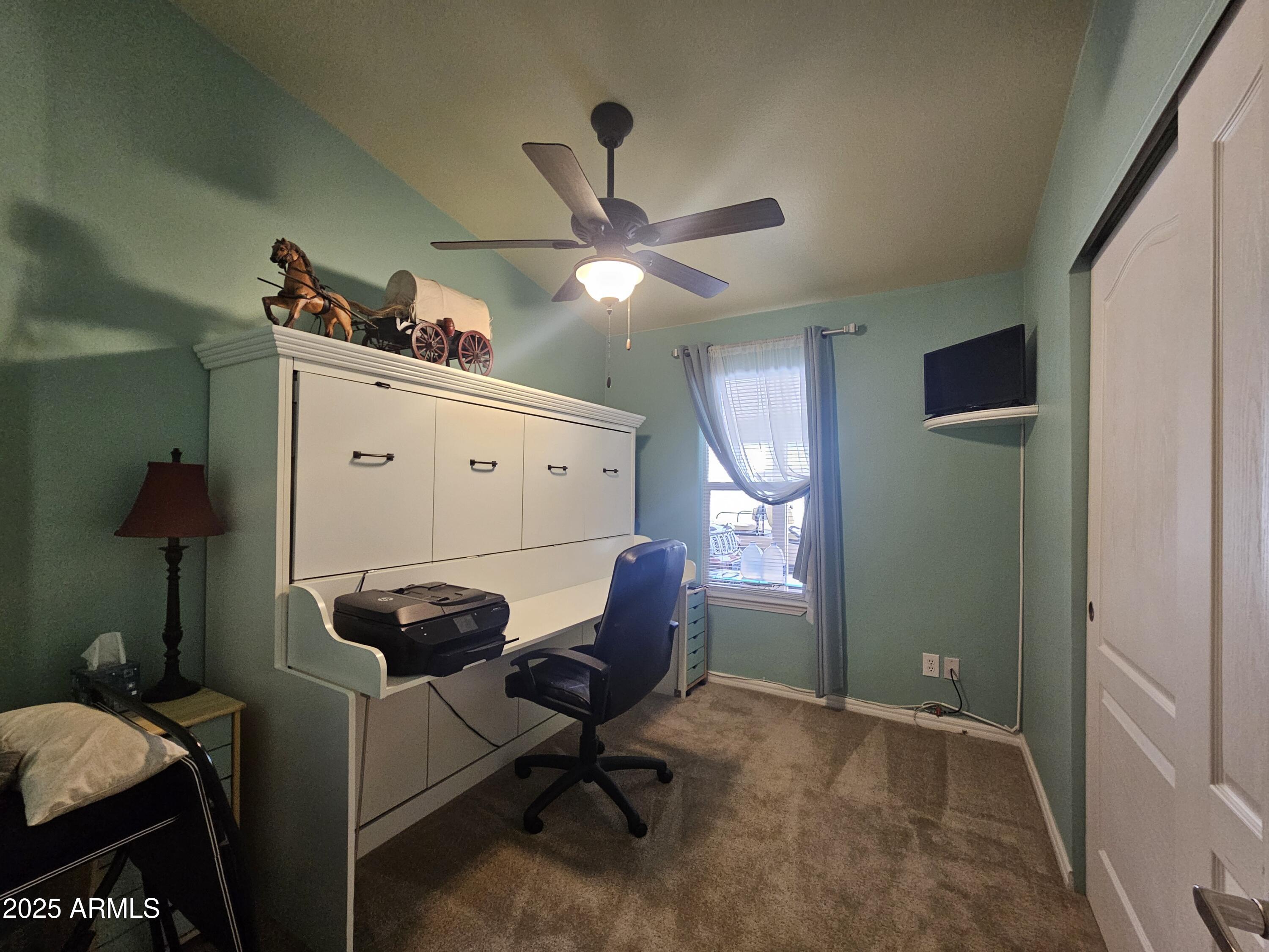 650 North Hawes Road, Unit 4326 Mesa, AZ 85207 - Photo 4 of 48 a workspace with furniture and chandelier